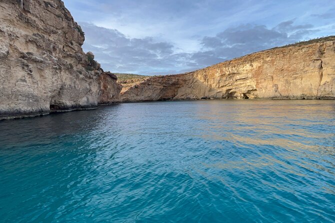 Blue Lagoon Ferry and Caves Tour - Getting there: Mgarr Gozo, the blue umbrella, and finding your boat
