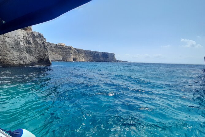 Boat Charters Blue lagoon, Crystal Lagoon, Comino, Malta 4hr trip - Crystal Lagoon: snorkeling, cliff diving, and cave-landmark spotting