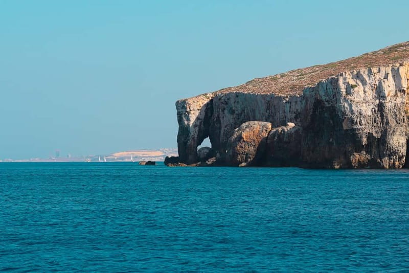 Comino: Blue Lagoon, Crystal Lagoon and Sea Caves Boat Tour - Scenic cruising past Comino Tower, Gozo views, and classic photo rocks