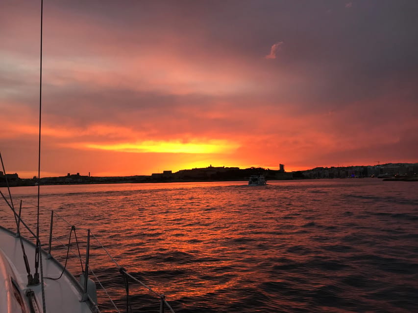 From Valletta: Romantic Sunset Cruise on a Sailing Yacht - Anchor dinner under the stars: what to expect with food and wine