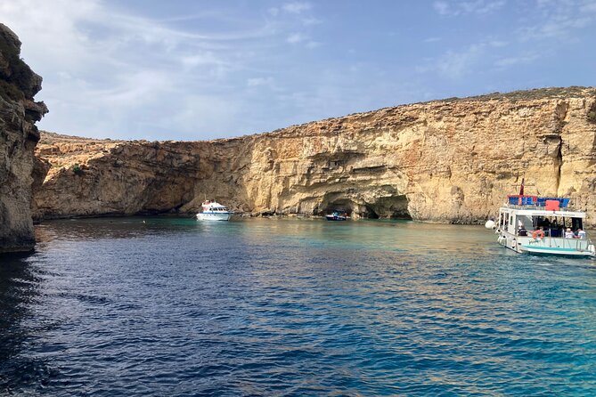 Full Day Private charter to Crystal & Blue Lagoon, Caves & Gozo - Gozo first stop: Mġarr Harbour, boats, and a seafood lunch window