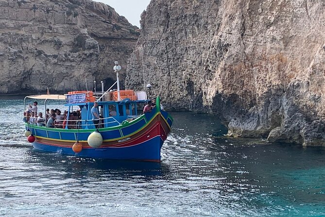 Full Day Private charter to Crystal & Blue Lagoon, Caves & Gozo - Crystal Lagoon: cave swims, cliff jumping, and the Saint Mary tower view
