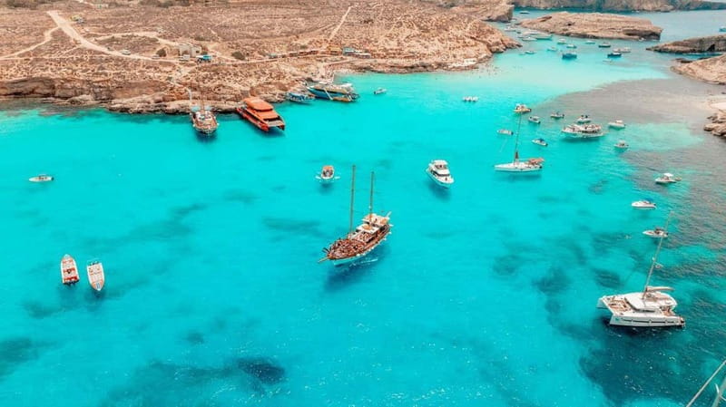 Malta: Around Comino Boat Trip with Gozo Guided Jeep Tour - Comino boat cruise, caves, and the Count of Monte Cristo filming connection