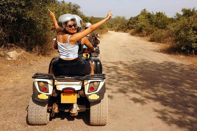 Malta: Half-Day Quad Bike Adventure Tour Including Transfers - Armier Bay swim stop: the best use of the summer window