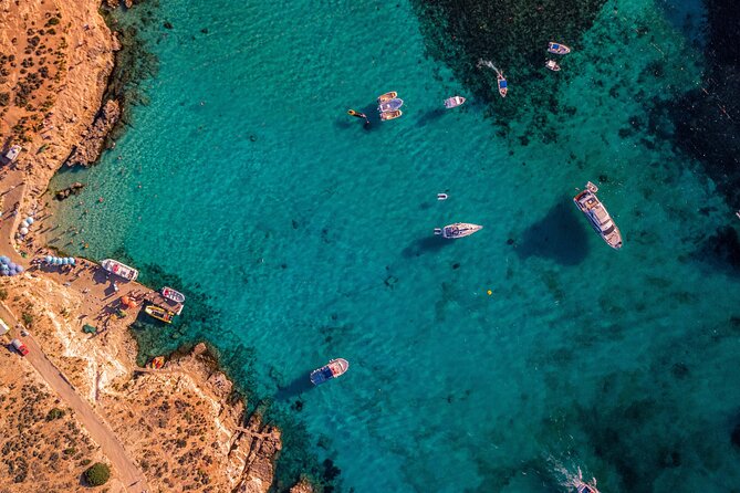 Malta Private Charter from Mellieha: Gozo, Comino, Blue Lagoon - Gozo from the water: Hondoq ir-Rumien, Mgarr Harbour, and Qala