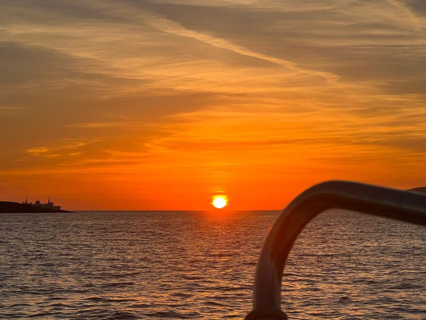 Malta: Private Sunset Boat Trip to Comino and Blue Lagoon - Comino caves, bays, and local legend talk on the move