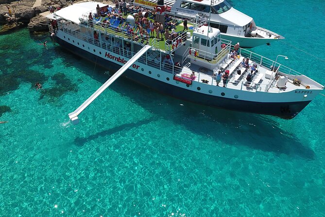 Malta Sunset Boat Tour: Bugibba to Comino Blue Lagoon Cruise - Sunset photos, jump time, and the hour-long return under stars