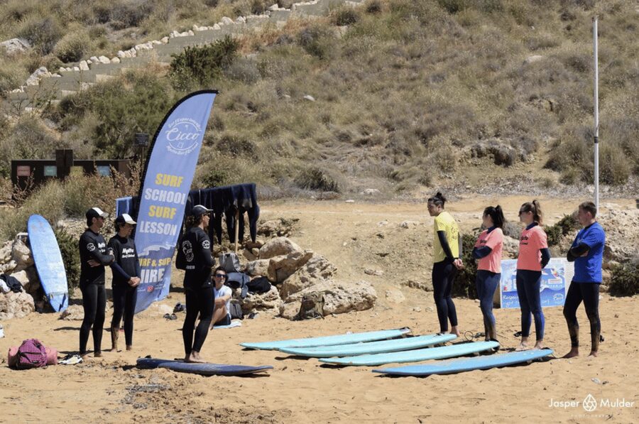 Malta Surf School, Beginner Surf Lessons - Entering the lesson at the beach by Singita kiosk
