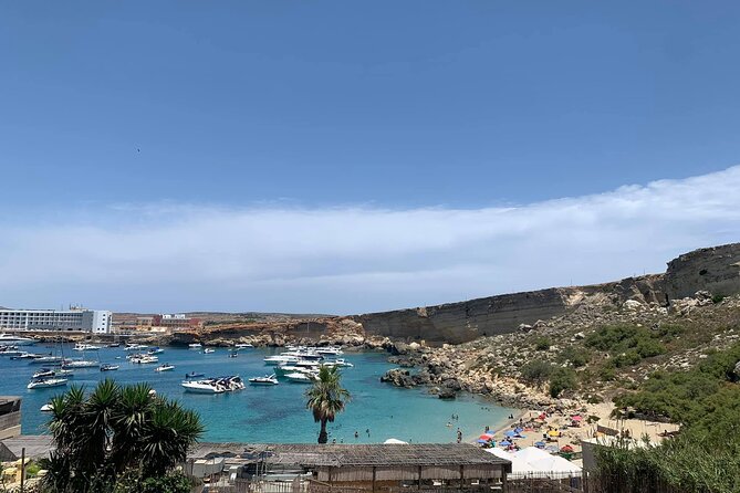 PARADISE BAY Sandy Beach (Half Day with Pick-up) - Paradise Bay stop: swimming, sunbathing, snorkelling, and water-sports options
