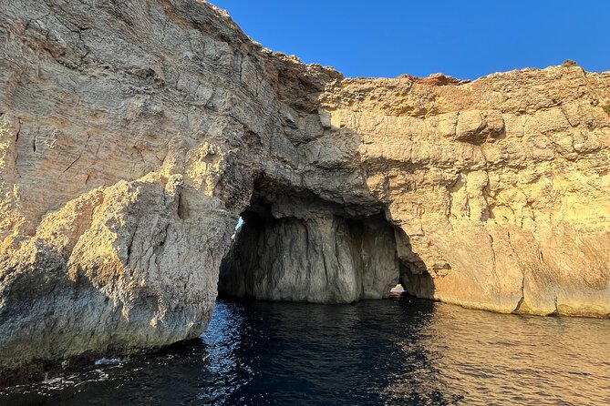 Private Boat Charter Blue Lagoon Crystal Lagoon and Comino - Stop 3: L-Ghar ta Bla Saqaf for cliffside cave atmosphere