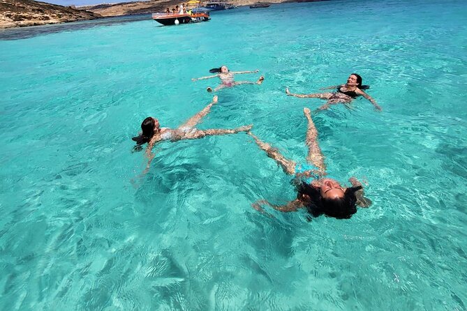 Private Boat Tour at Comino's Blue Lagoon and Crystal Lagoon - Cominotto Reef: shallow water, marine life, and color