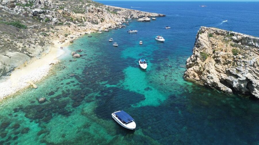 Sliema: Boat Trip to Comino Blue Lagoon, Gozo, and Caves - Comino caves by boat: limestone drama without the hike