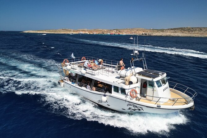Three Bay Cruise Including Blue Lagoon from Mellieha - Stop 2 in Comino: Crystal Lagoon’s sheltered feel and sea caves
